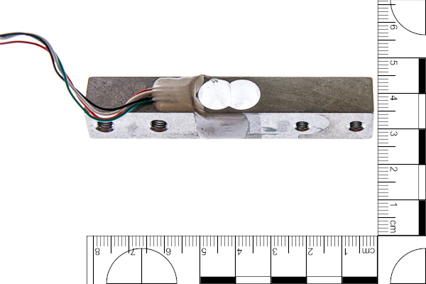 weight cell with ruler for scale